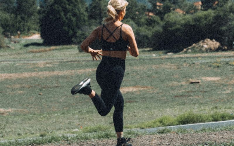 Woman running alone on an outdoor trail